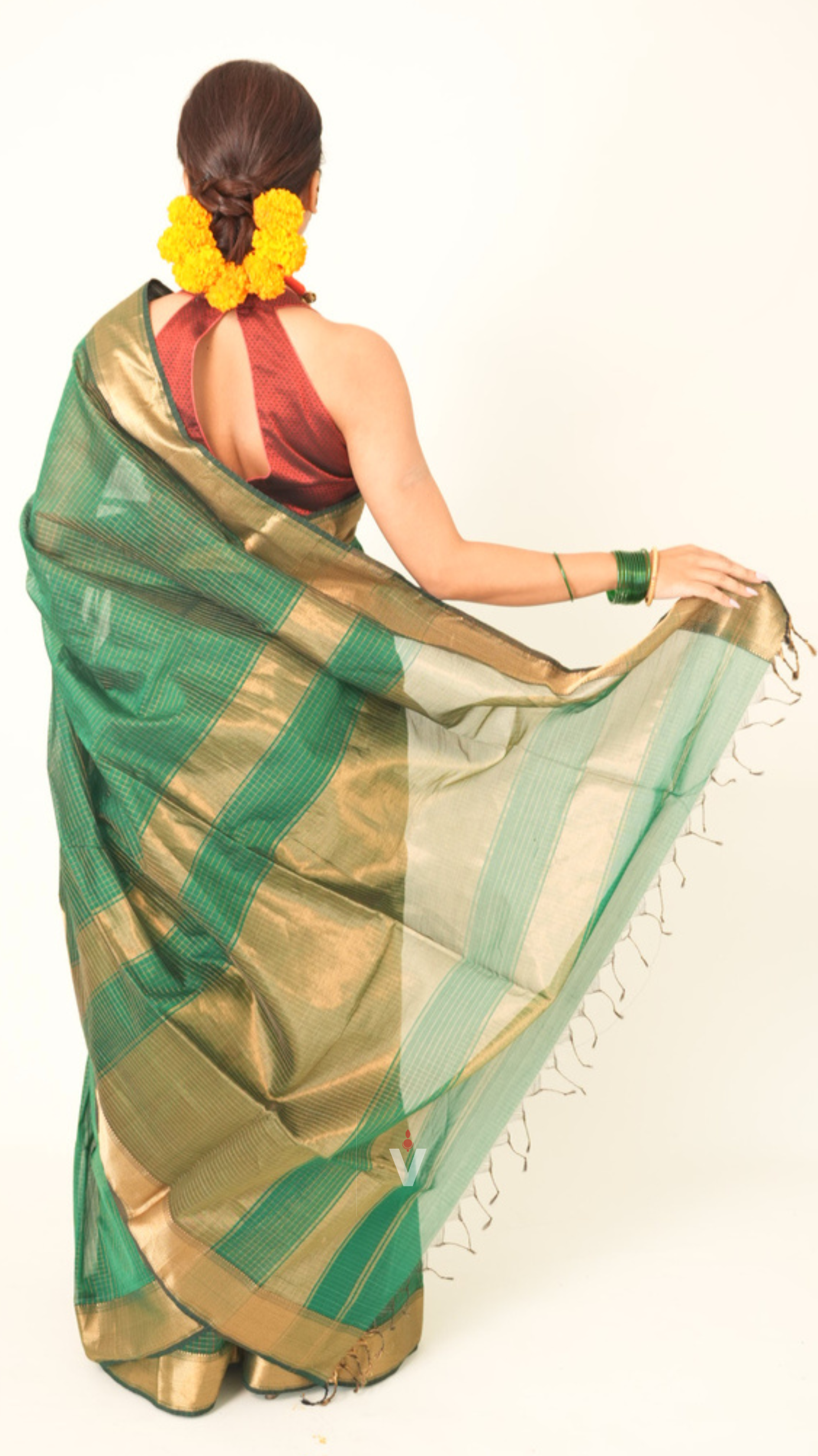 Graceful drape of Green Zari Checks Handloom Maheshwari Saree for festive occasions
